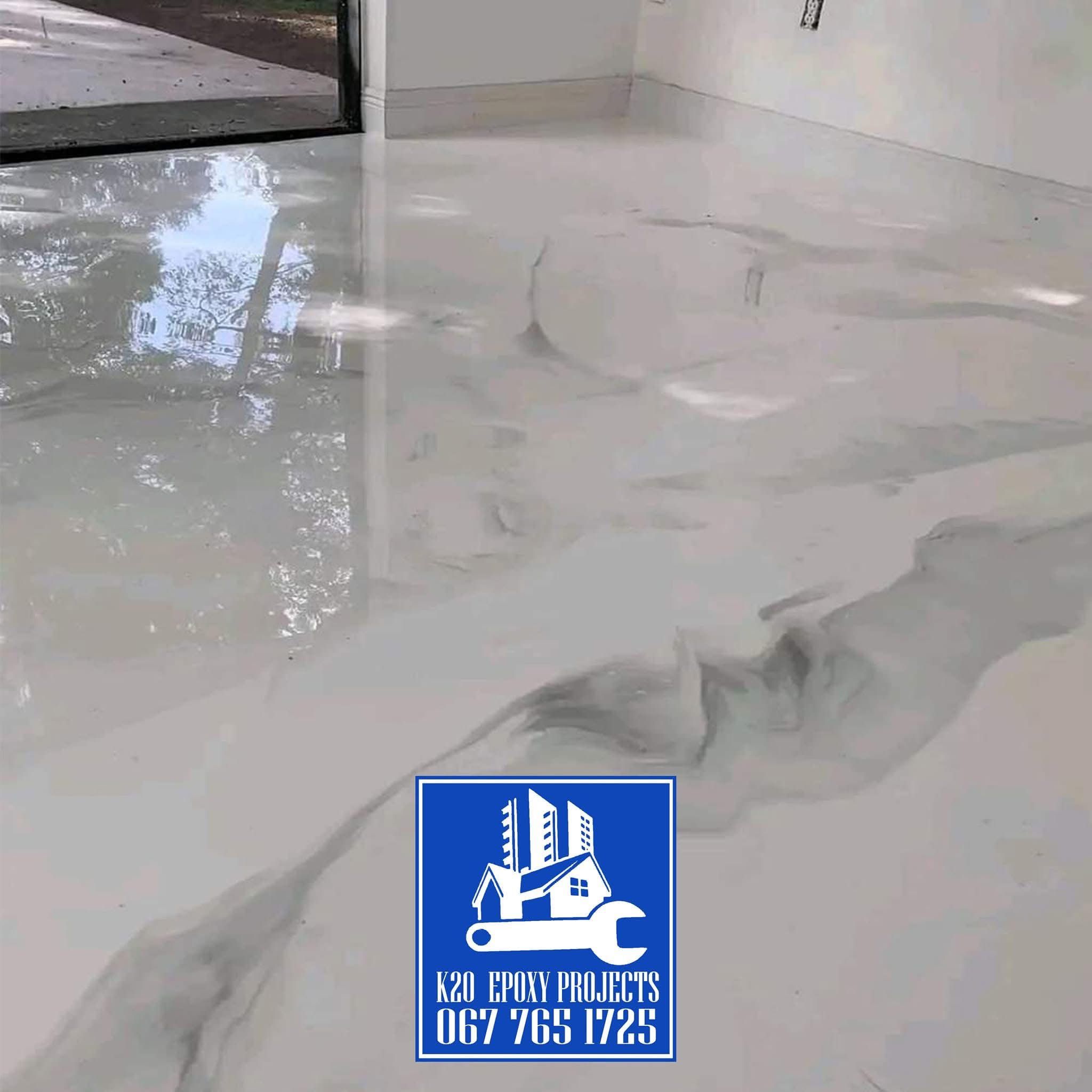 Pearl metallic epoxy floor with soft grey veining