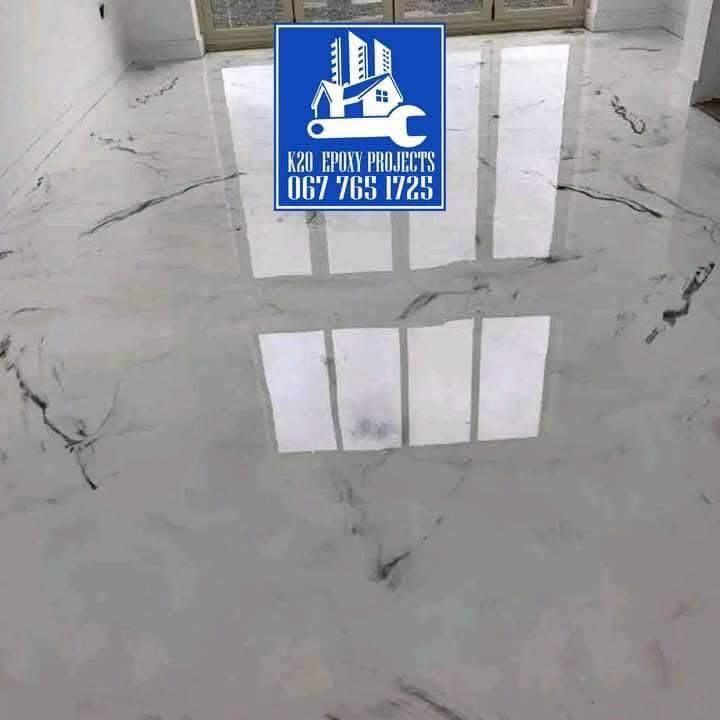 White marble epoxy floor reflecting window light in a finished interior