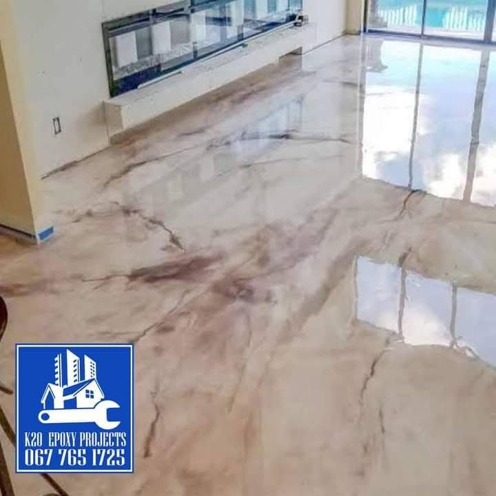 Pearl and rose metallic epoxy floor in a bright residential living space