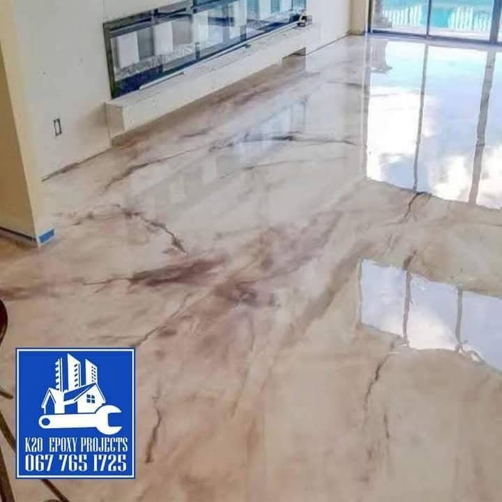 Wide pearl marble epoxy floor with window reflections